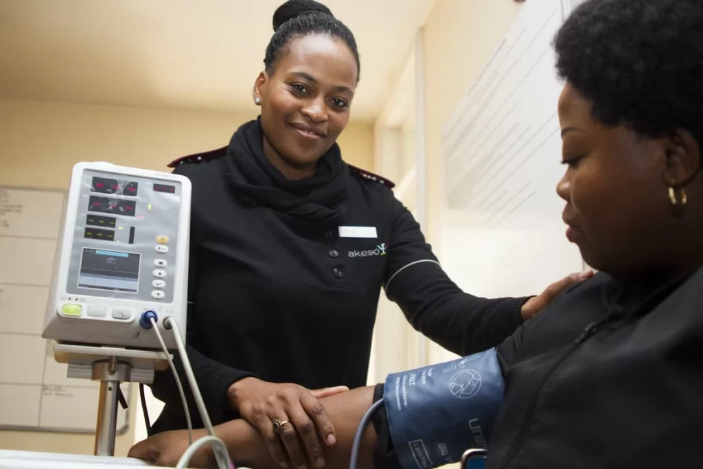 woman getting her blood pressure tested