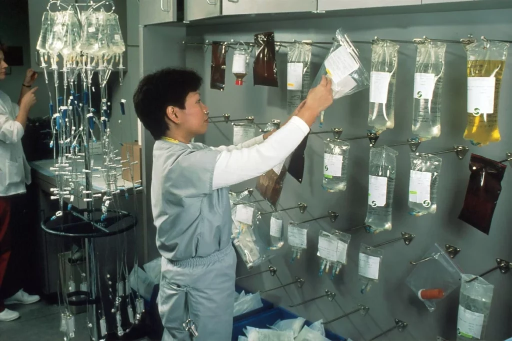 Nurse checking labels on hormone therapy medication